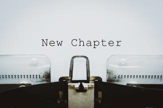 Image of a typewriter typing ''New Chapter'