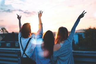 Image of 3 ladies enjoying the sunset